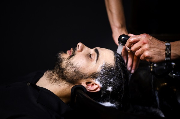 customer getting their hair washed with shampoo